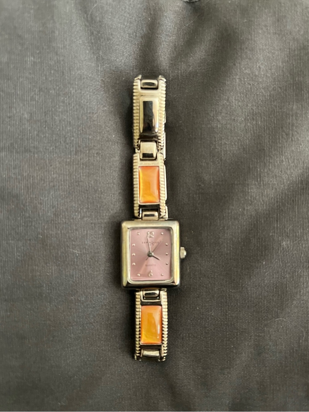 Vintage LA Express watch with a silver-tone band and a pink quartz dial.